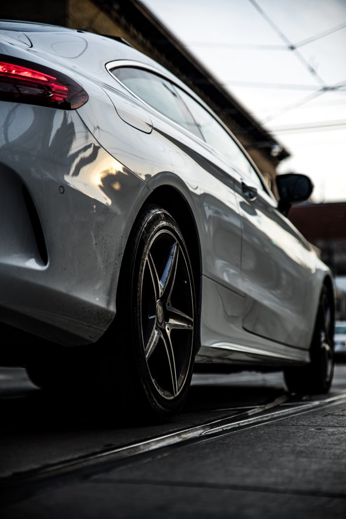 close-up-photography-of-silver-sports-car-1236809-683x1024