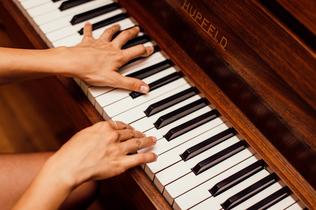 close-up-photo-of-person-playing-piano-1246437-1024x683
