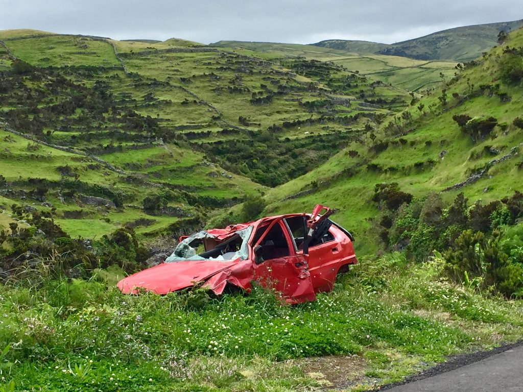 photo-of-broken-red-car-on-grass-3368844-1024x768