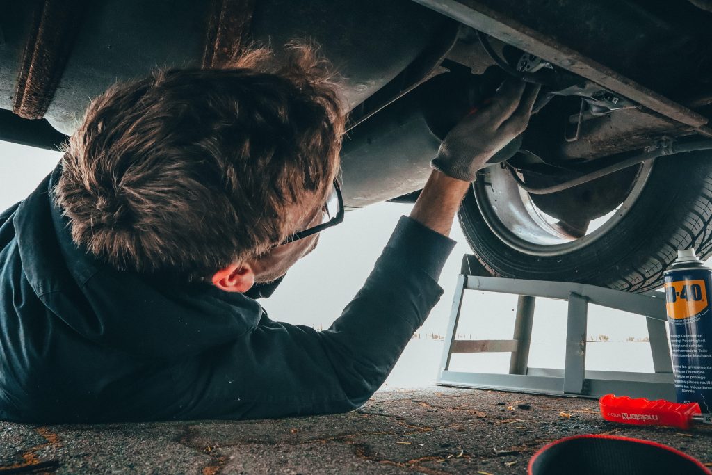 man-fixing-vehicle-engine-2244746-1024x683